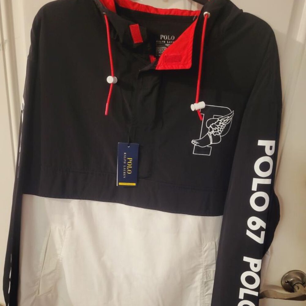 Polo men's medium size windbreaker style pullover, soft material with pockets.